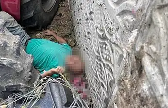 Kullandığı traktörün altında kalan çiftçi ağır yaralandı