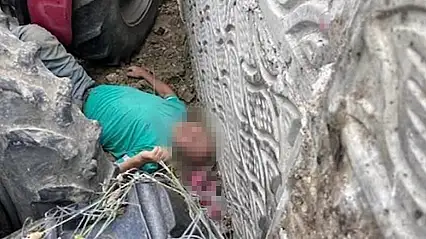 Kullandığı traktörün altında kalan çiftçi ağır yaralandı