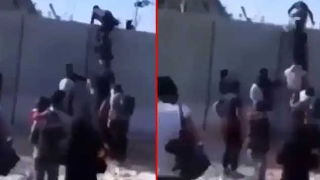 SINIRDA ENDİŞE YARATAN GÖRÜNTÜ! GÜVENLİK DUVARINI MERDİVENLE AŞTILAR