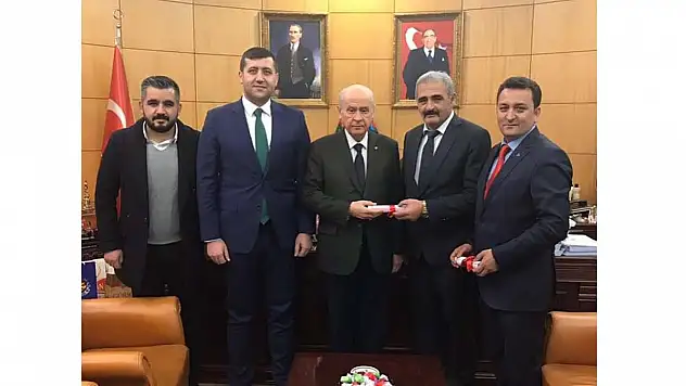 TAPULAR DEVLET BAHÇELİ'YE TESLİM EDİLDİ